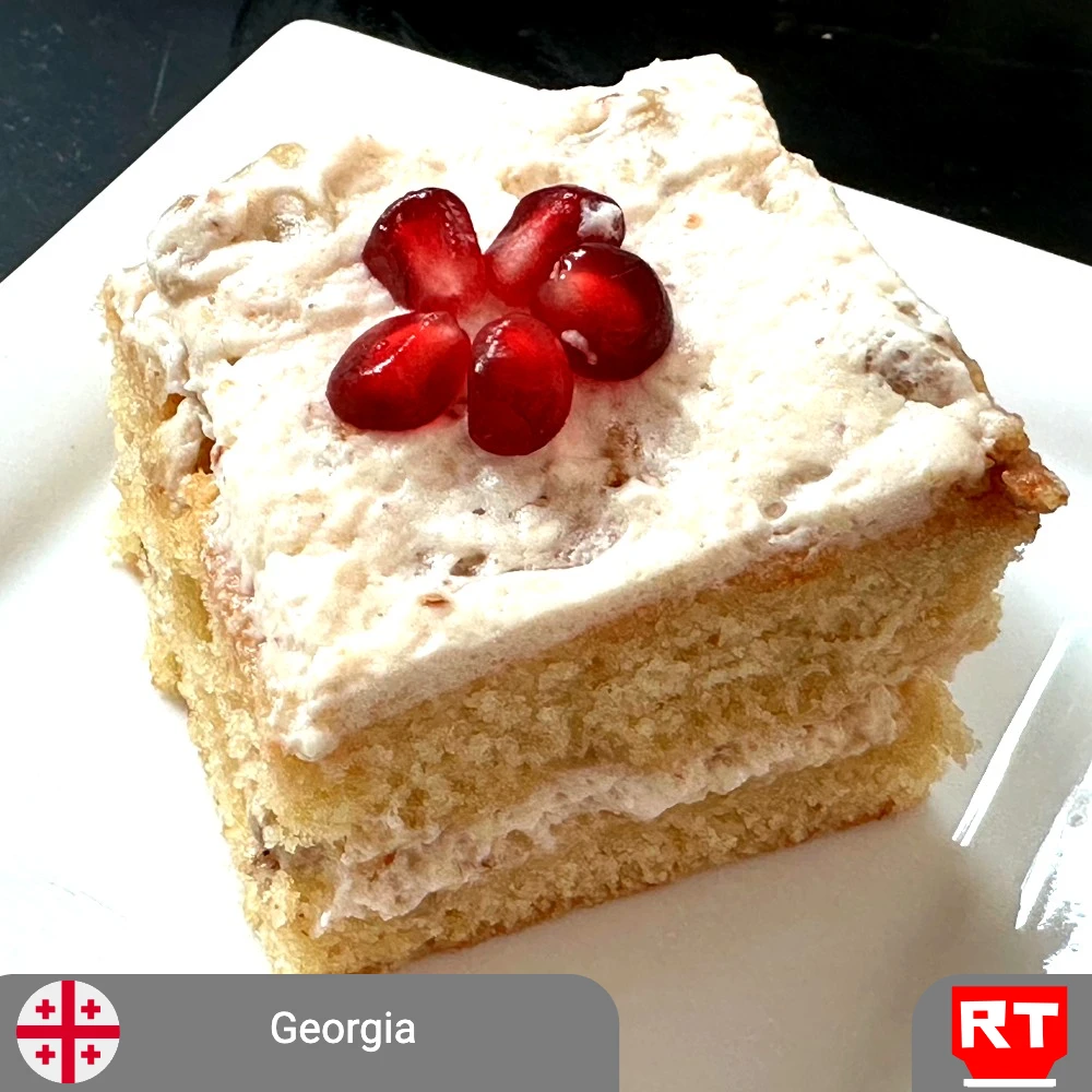 Honey Walnut Cake with Whipped Cream and Pomegranate Flower