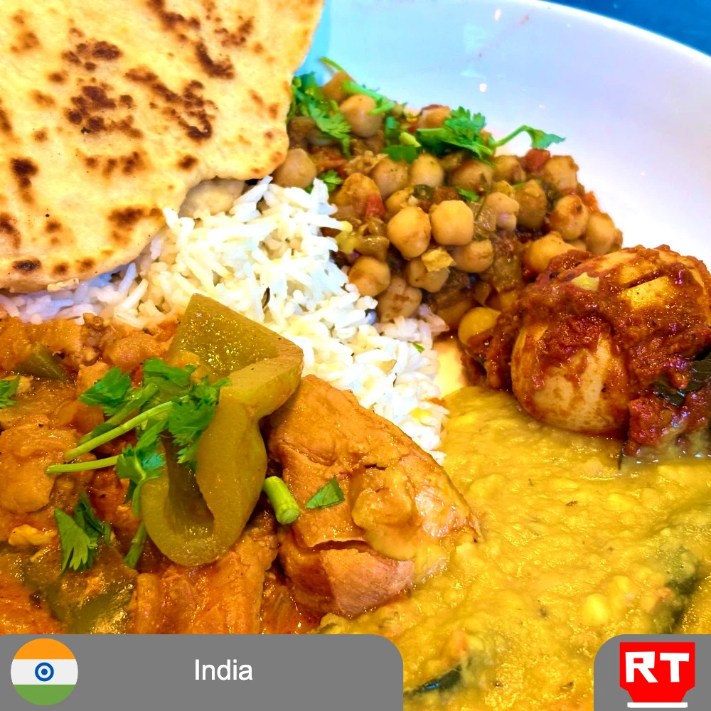 An Indian Feast: Butter Chicken, Chana Masala, Dal Tadka, Kerala Masala Egg Roast, Jeera Rice and House-Made Naan (includes complimentary surprise dessert)