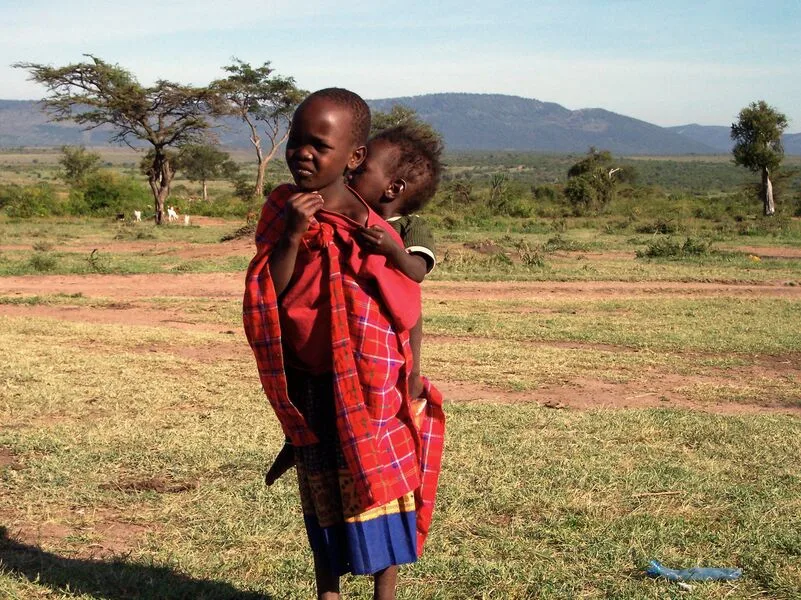 East African Chicken Curry with colorful condiments and steamed rice (includes complimentary surprise dessert)