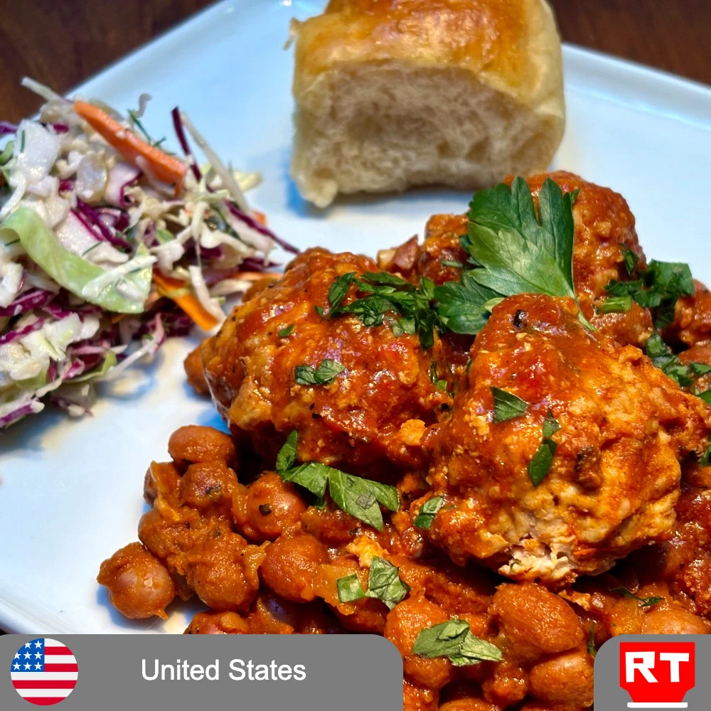 United States: New England–Style Baked Beans with Smoky BBQ Tomato Sauce and Chicken Meatballs, Cabbage Slaw & Soft Roll (Vegetarian Upon Request) (includes complimentary surprise dessert)