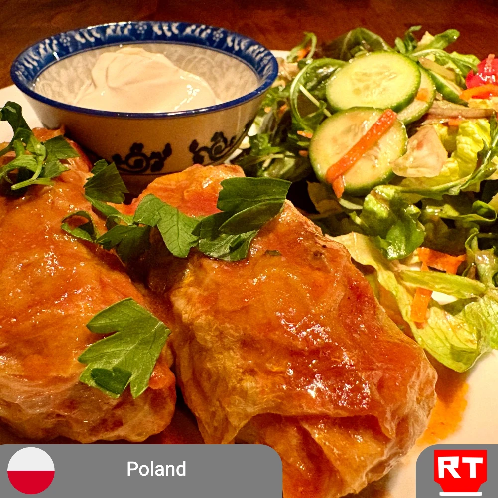 Gołąbki: Hearty Polish Cabbage Rolls with Meat or Vegetarian Filling, Served with Sour Cream and Fresh Greens (includes complimentary surprise dessert)