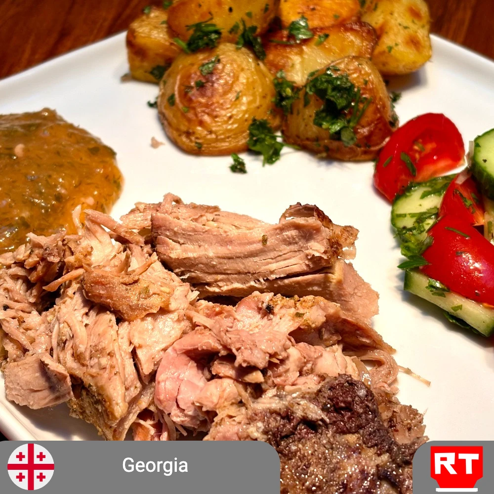 Georgian Slow-Roasted Pork Shoulder with Homemade Tkemali, Herb-Roasted Potatoes & Fresh Tomato-Cucumber Salad (includes complimentary surprise dessert)
